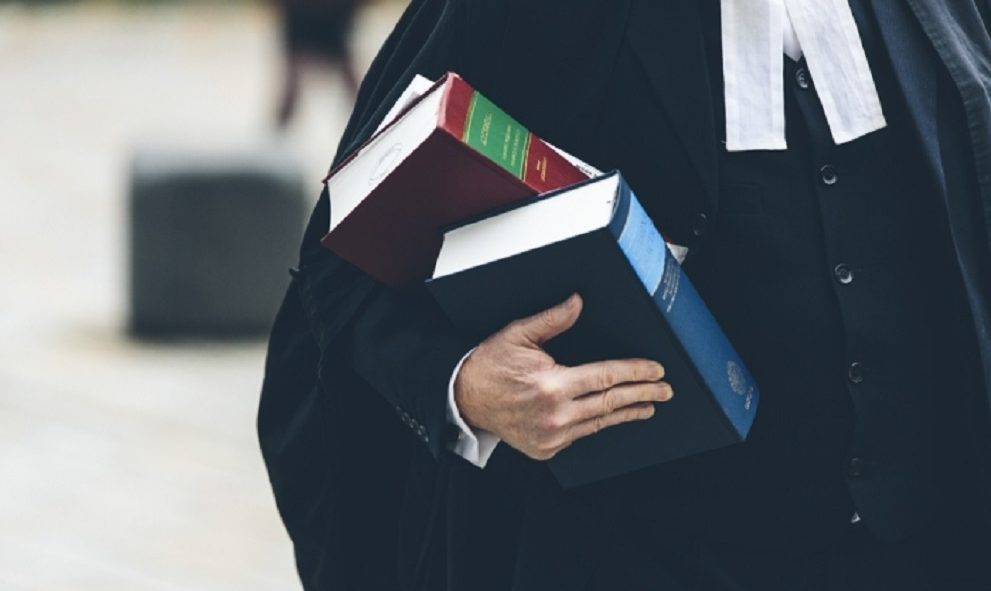 barrister holding two law text books