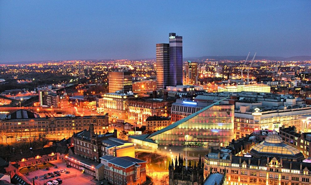 Manchester, EnglanManchester city center skyline at night showing various buildings and streets
